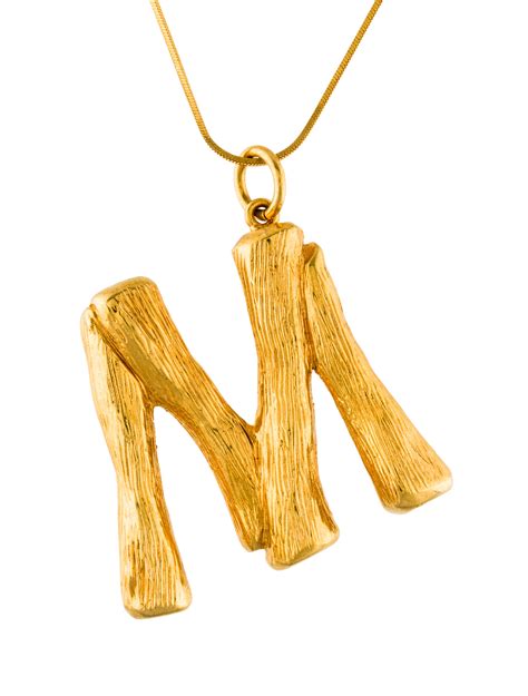 Alphabet M pendant in brass 